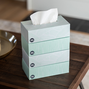 4 boxes of Save Trees' bamboo facial tissues stacked on coffee table